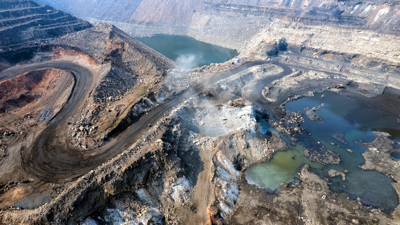 Mastering the First Impression: Your intriguing post title goes here Expansive aerial shot of an active coal mine in Dhanbad, Jharkhand, India.
