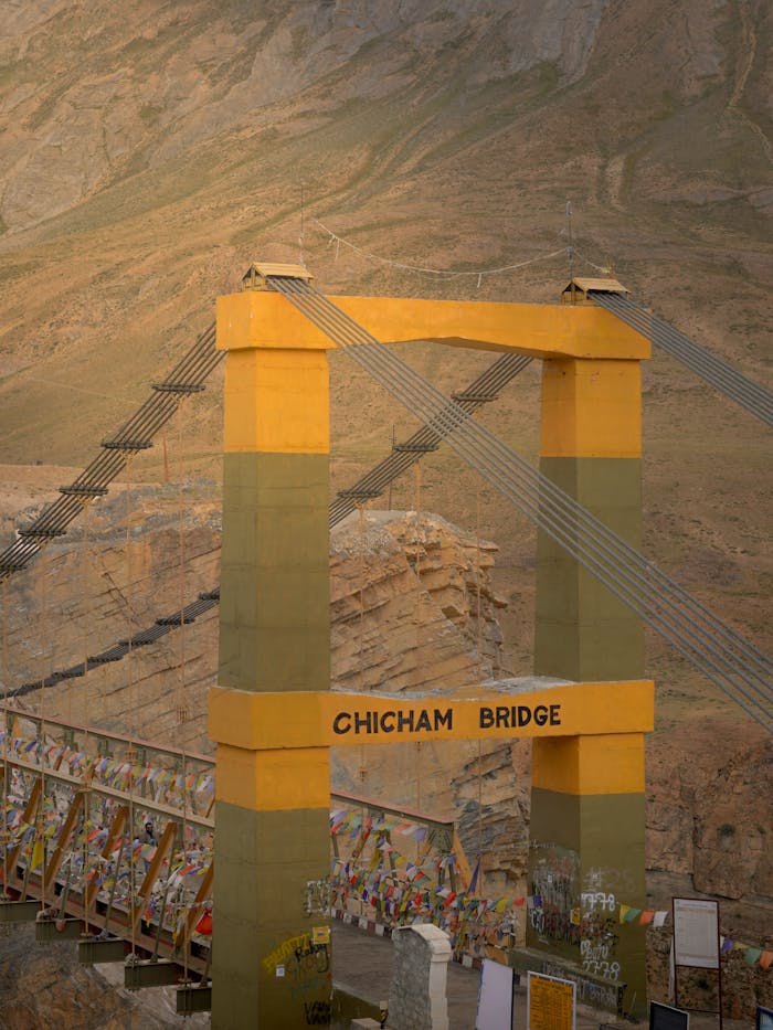 The Chicham Bridge spans a breathtaking Himalayan gorge, adorned with prayer flags.