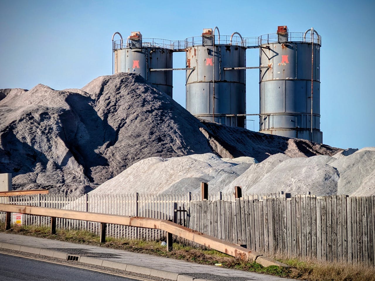 services-05 Tall industrial silos surrounded by mounds of materials in Middlesbrough, England